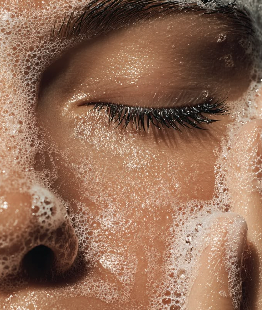 Close-up of cleansing foam on glowing skin